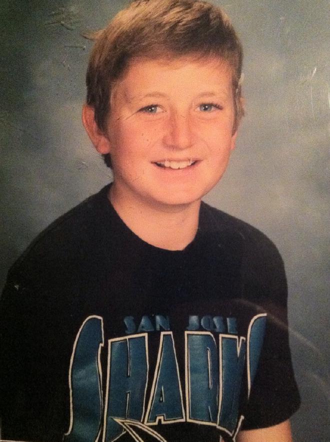 Chris wearing a Sharks shirt in his school portrait