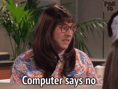 A gif of a scene from the TV show Little Britain, a woman sits behind a desk typing into a computer and speaking, the caption reads 'Computer says no'
